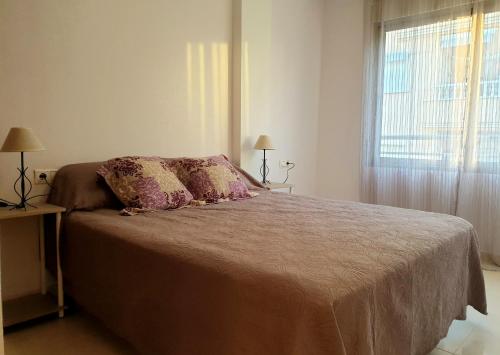 Posteľ alebo postele v izbe v ubytovaní Los Locos Beach Apartments