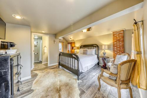 a bedroom with a bed and a fireplace at The Cabin @ Durst Haus in Fredericksburg