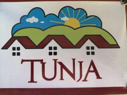 a sign for a jumeirah sign with a cloud at Hotel Cabañas El Rincón de las Campanas in Nobsa