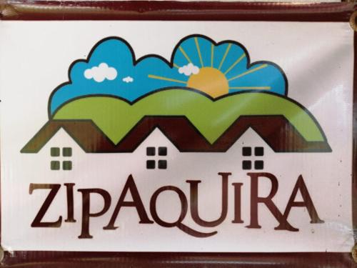 a sign for a zaporizaria gas station at Hotel Cabañas El Rincón de las Campanas in Nobsa