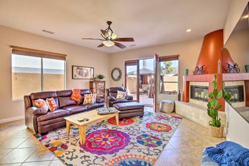 a living room with a couch and a fireplace at Lavish Escape with Pool 1 Mi to Old Town La Quinta! in La Quinta