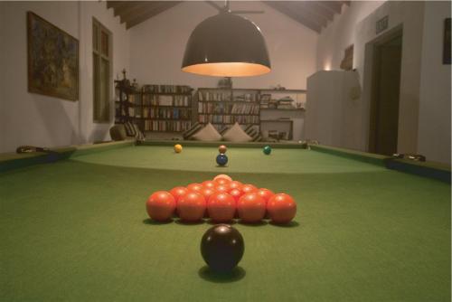 a snooker table with balls on top of it at Villa Hundira in Negombo
