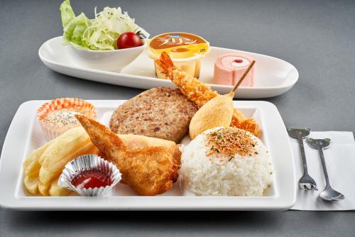 a white plate of food with rice and vegetables at LiVEMAX RESORT Hakodate Greenpia Onuma in Mori