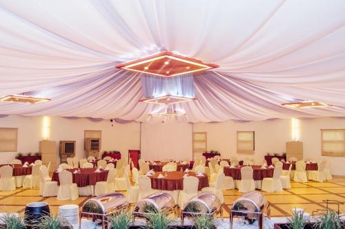 a large banquet hall with tables and chairs at Azalea Residences Baguio in Baguio