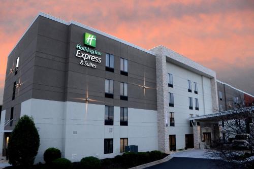 an office building with a hospital employees advice sign on it at Holiday Inn Express & Suites Raleigh Durham Airport at RTP by IHG in Durham
