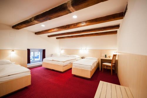Postel nebo postele na pokoji v ubytování Hotel Pivovar