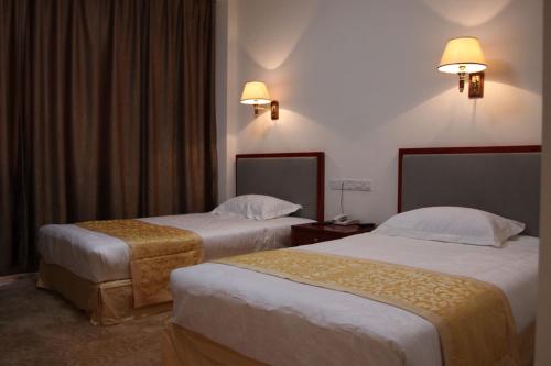 Voodi või voodid majutusasutuse Soluxe Club International Hotel toas