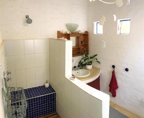 a small bathroom with a sink and a sink at Artist's Attic in Nelspruit