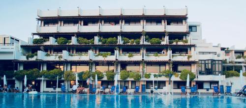 a hotel with a pool in front of it at Puntaquattroventi in Ercolano