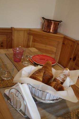 a basket of bread is sitting on a table at L'Helleboro in Viggiù