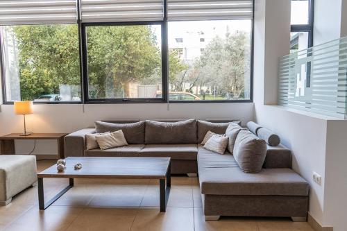 a living room with a couch and a table at HOTEL HILL in Athens
