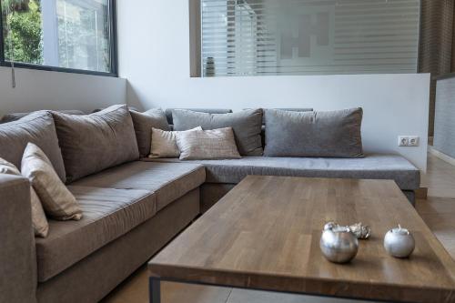 a living room with a couch and a coffee table at HOTEL HILL in Athens