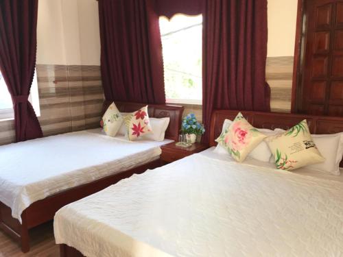 Ένα ή περισσότερα κρεβάτια σε δωμάτιο στο Dai Thanh 1 Motel Cang Sa Ky