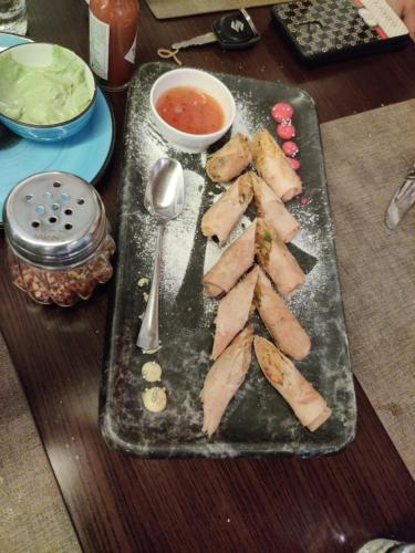 a tray of food on a table with a plate of food at Hotel Exotic - 5 min walk from Golden Temple in Amritsar