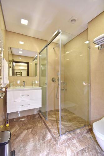 a bathroom with a shower and a sink at Northern Avenue 2 bedrooms New and Modern apartment in New Elite Building HH600 in Yerevan