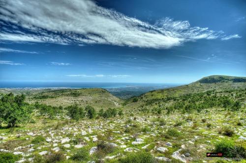 a view from the top of a hill with mountains at Hotel****Spa & Restaurant Cantemerle in Vence