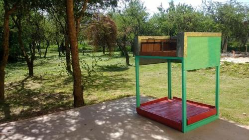 a colorful structure sitting in the middle of a park at apartamento VINTAGE IVA in Merlo