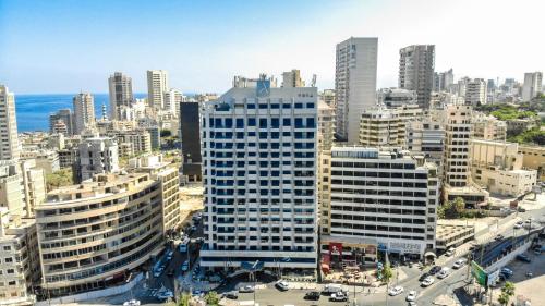 an aerial view of a city with tall buildings at Raouche Arjaan by Rotana in Beirut