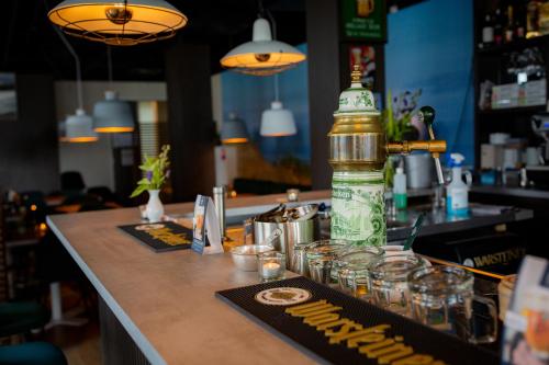 a bar with a bottle of alcohol on a counter at Villa Zeezicht in Noordwijk