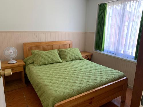 Cama o camas de una habitación en Cabañas Punto Verde