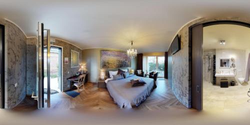 a bedroom with a large bed in a room at Art Of Dreams Deluxe 4 stars in Laakdal