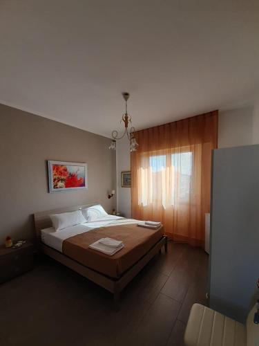 a bedroom with a large bed in a room at Le Quattro Isole in Marsala
