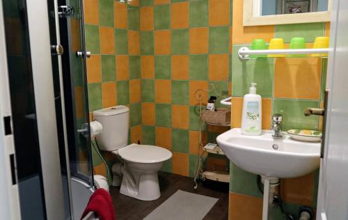 a bathroom with a toilet and a sink at Pension Grant Lux Znojmo in Znojmo