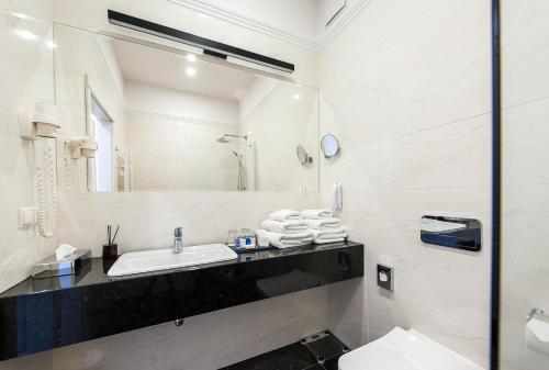 Ванная комната в Hotel Royal & Spa