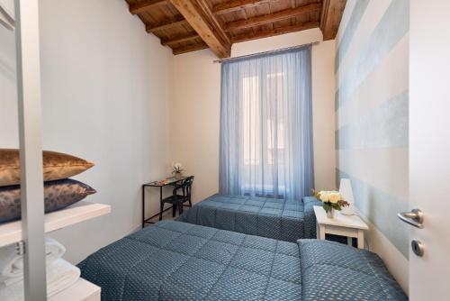 Ein Bett oder Betten in einem Zimmer der Unterkunft Windows On Florence