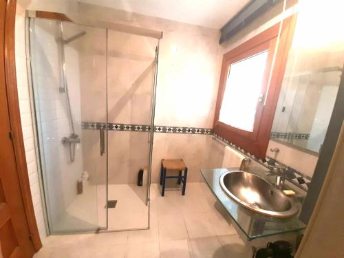 a bathroom with a shower and a sink at Baldissera in Estella