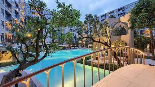 a view of a swimming pool from a balcony at La casita Hua-Hin seaview by Yaya in Hua Hin
