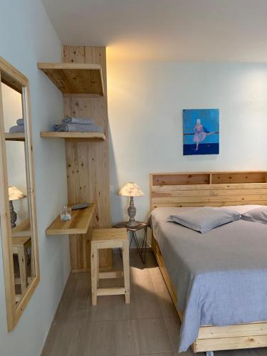 מיטה או מיטות בחדר ב-Secret de Jardin New