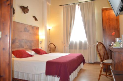 Postel nebo postele na pokoji v ubytování Gara Hotel