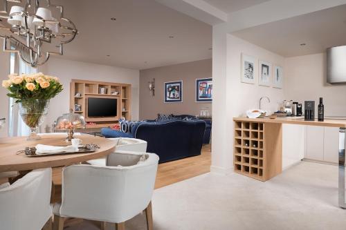 a kitchen and living room with a table and chairs at Villa Petra by HMZ Villas in Vabriga