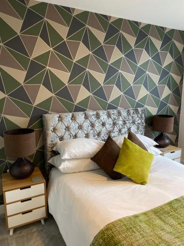 A bed or beds in a room at Smart Stays Boutique Apartments 