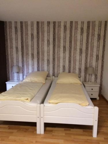 Ένα ή περισσότερα κρεβάτια σε δωμάτιο στο Appartements am Park
