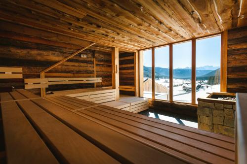 an empty sauna with a view of the mountains at Bio Aparthotel Blaslahof in Valle Di Casies