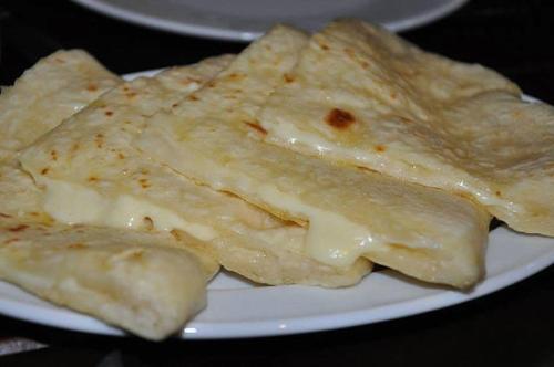 a white plate with some food on it at Anna'S Home in Kutaisi