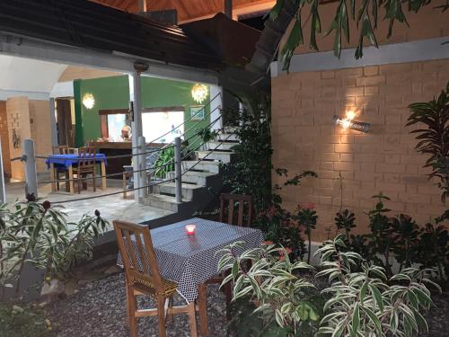 a patio with a table with a candle on it at Hôtel Amédzépé in Palimé