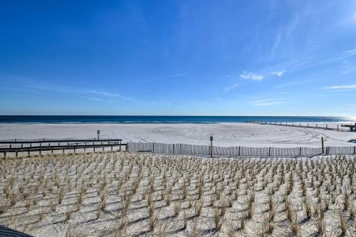 a sandy beach with the ocean in the background at Seaside Heights Beach Condo, Walk to Boardwlk in Seaside Heights