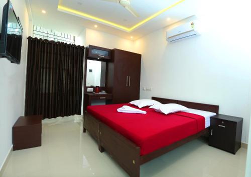 Un pat sau paturi într-o cameră la karibu Residency
