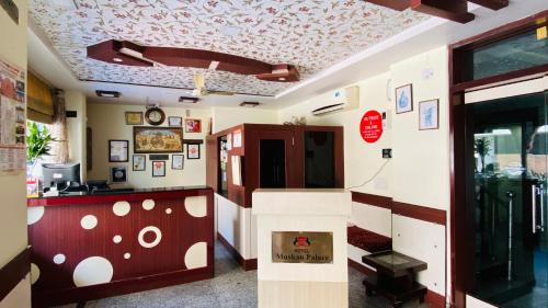 a restaurant with a ceiling with a design on it at Hotel Muskan Palace in Jaipur