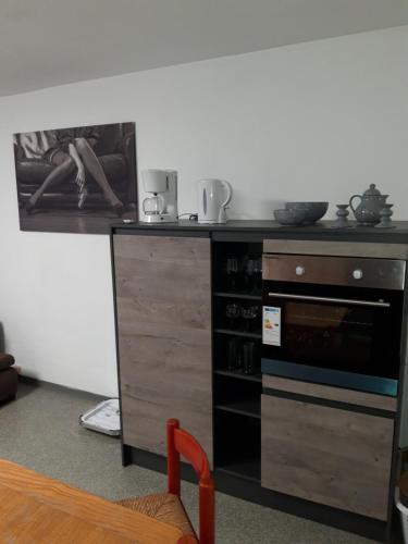 a kitchen with a counter top with a stove at St Maximin City Ferienwohnungen in Trier