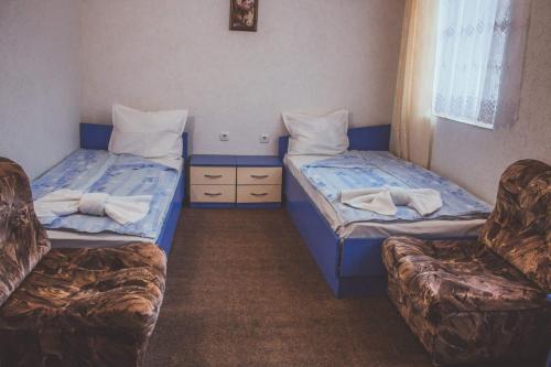 Кровать или кровати в номере Edi Hotel