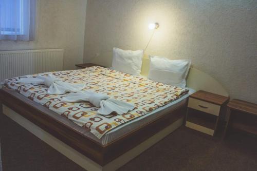 Кровать или кровати в номере Edi Hotel