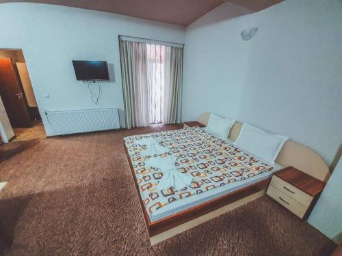 Кровать или кровати в номере Edi Hotel