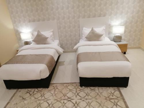 Katil atau katil-katil dalam bilik di Alshurfah Loft