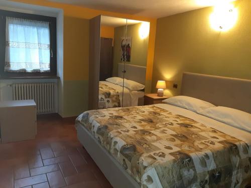 a bedroom with two beds and a mirror at CASA MAEL in Saint-Pierre