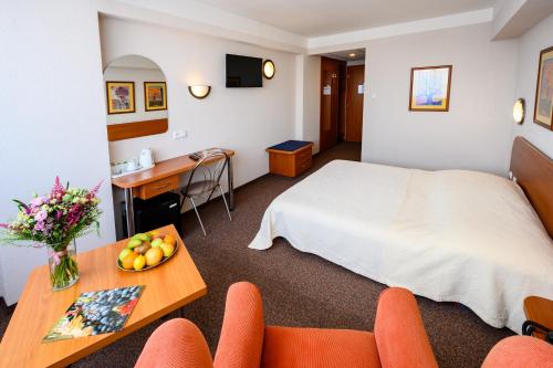 Posteľ alebo postele v izbe v ubytovaní Hotel Lux