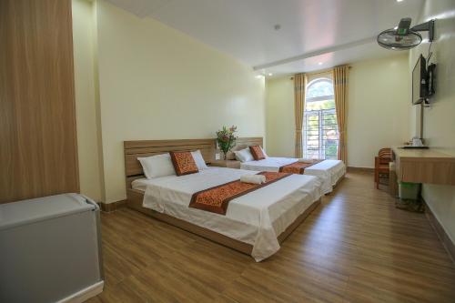 Postel nebo postele na pokoji v ubytování Cat Ba Green Hotel